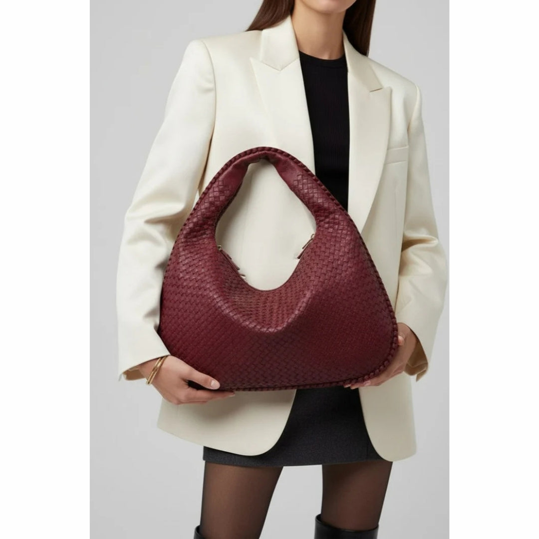 Elegante geflochtene Handtasche