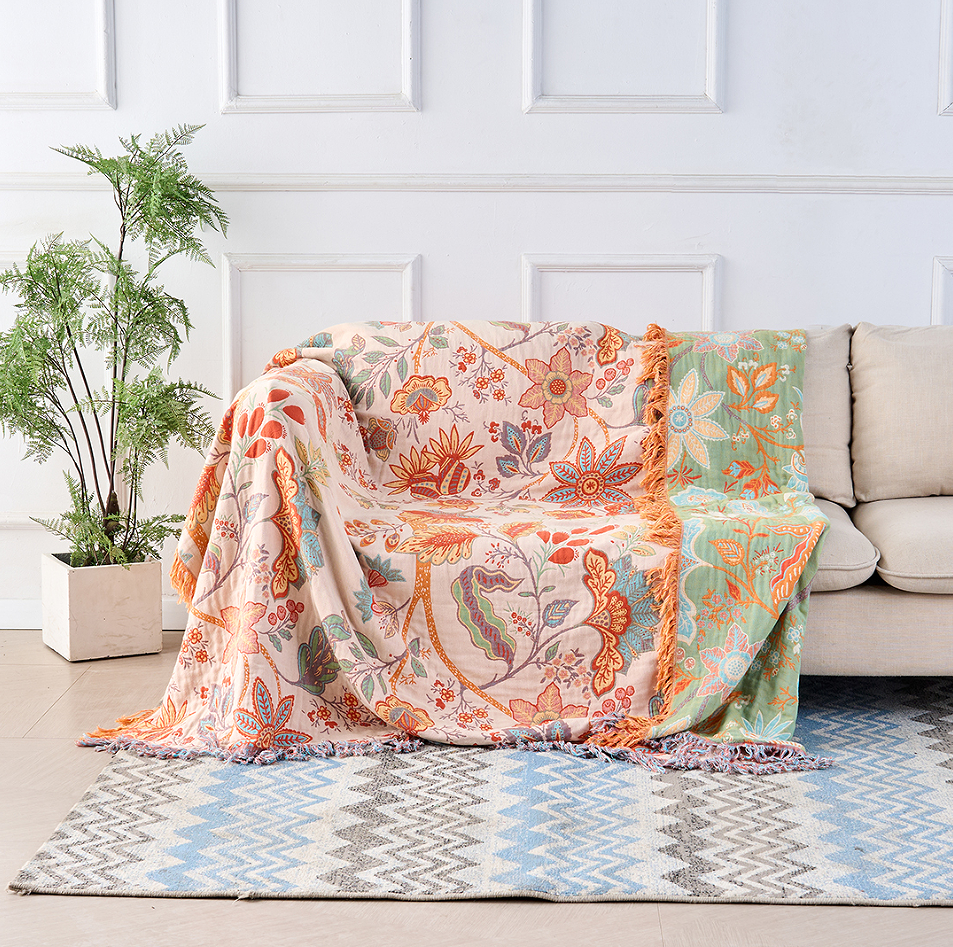 Florale Boho-Wohndecke aus Baumwolle mit kunstvollen Fransen