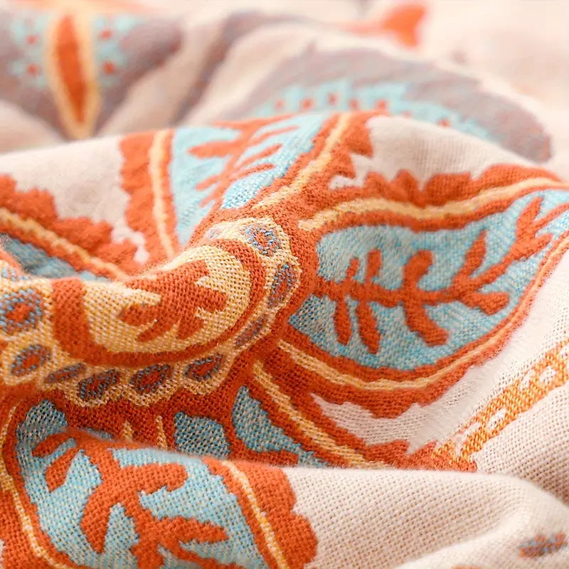 Florale Boho-Wohndecke aus Baumwolle mit kunstvollen Fransen