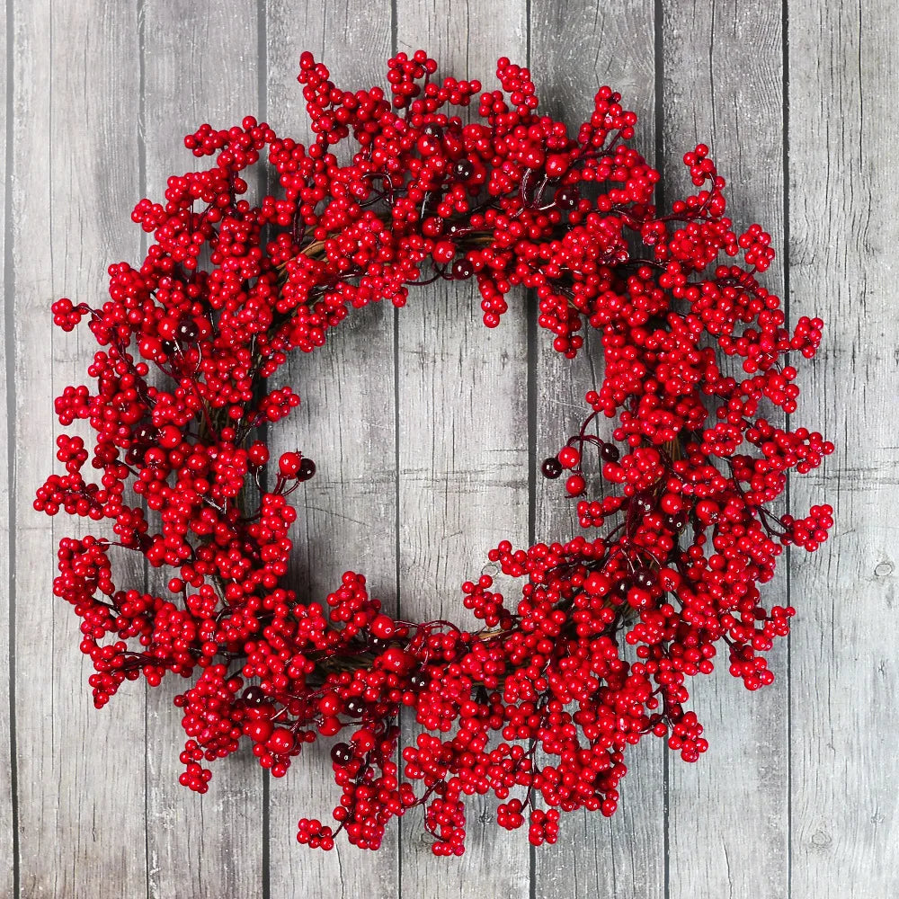 Weihnachtskranz mit roten Beeren
