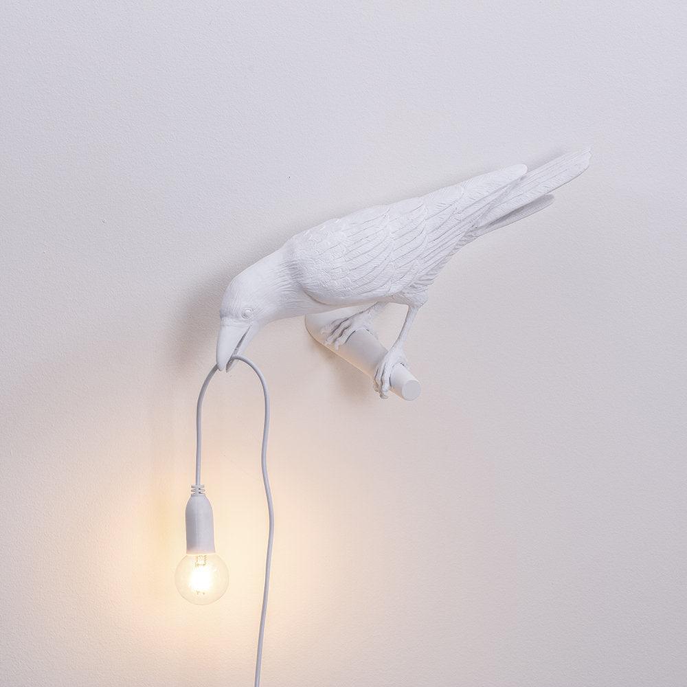 Wandlampe in Vogelform