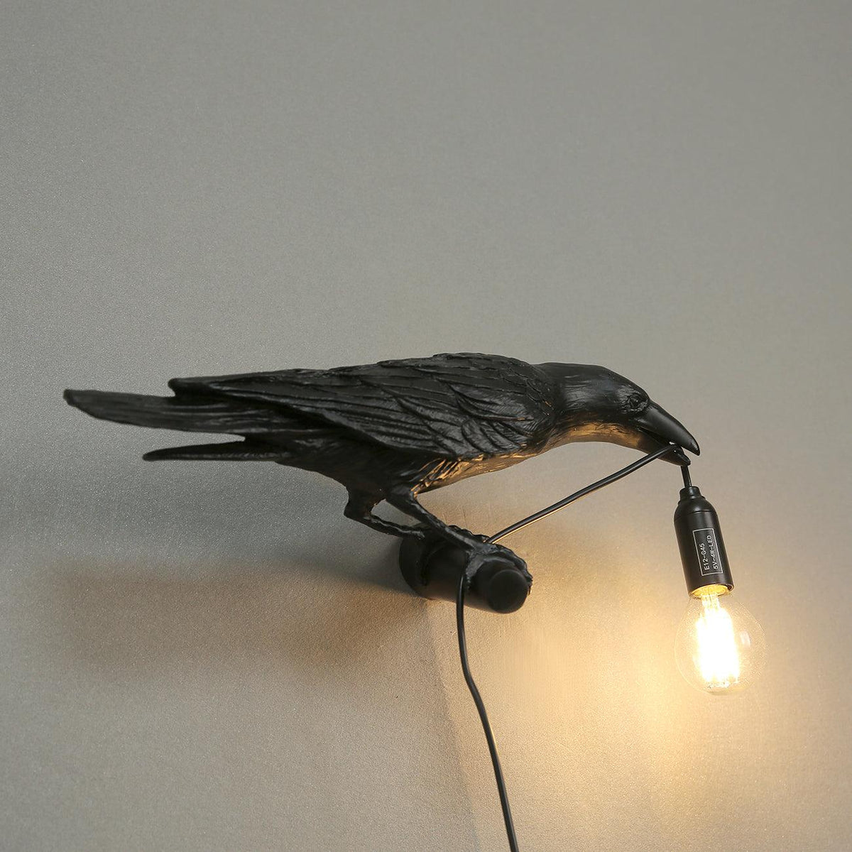 Wandlampe in Vogelform