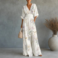 Gemusterter Jumpsuit mit V-Ausschnitt, weitem Bein, taillierter Taille und Taschen